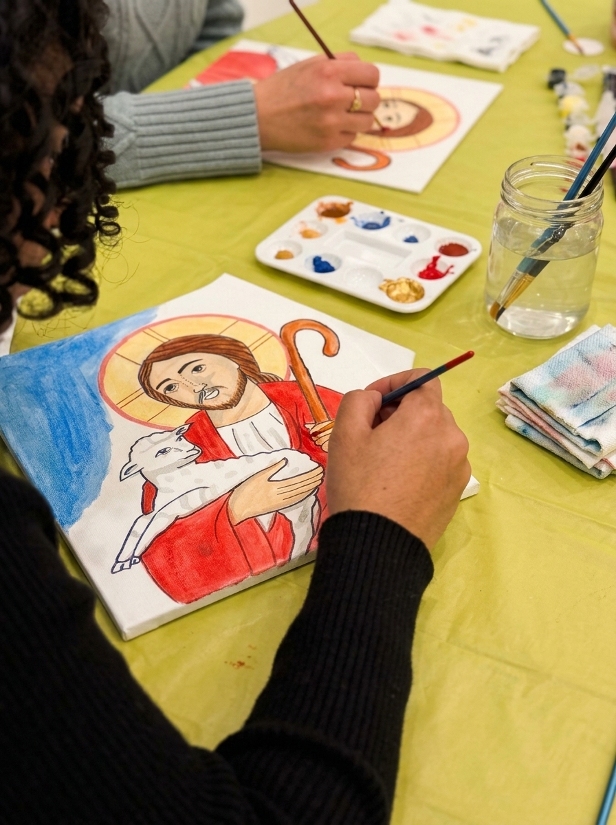 Participants painting Good Shepherd icons together at a group event